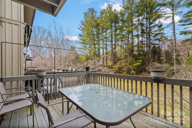 a view of a balcony with furniture