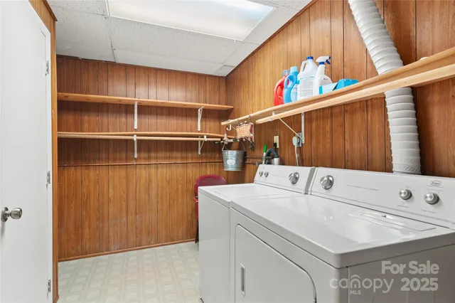 a view of a livingroom with workspace and a window