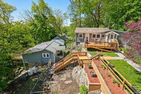 an aerial view of a house with a yard
