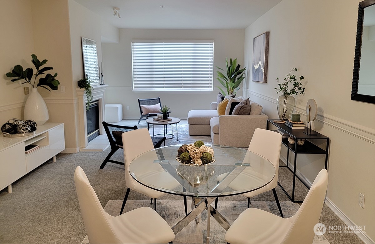 a view of a dining room with furniture and window