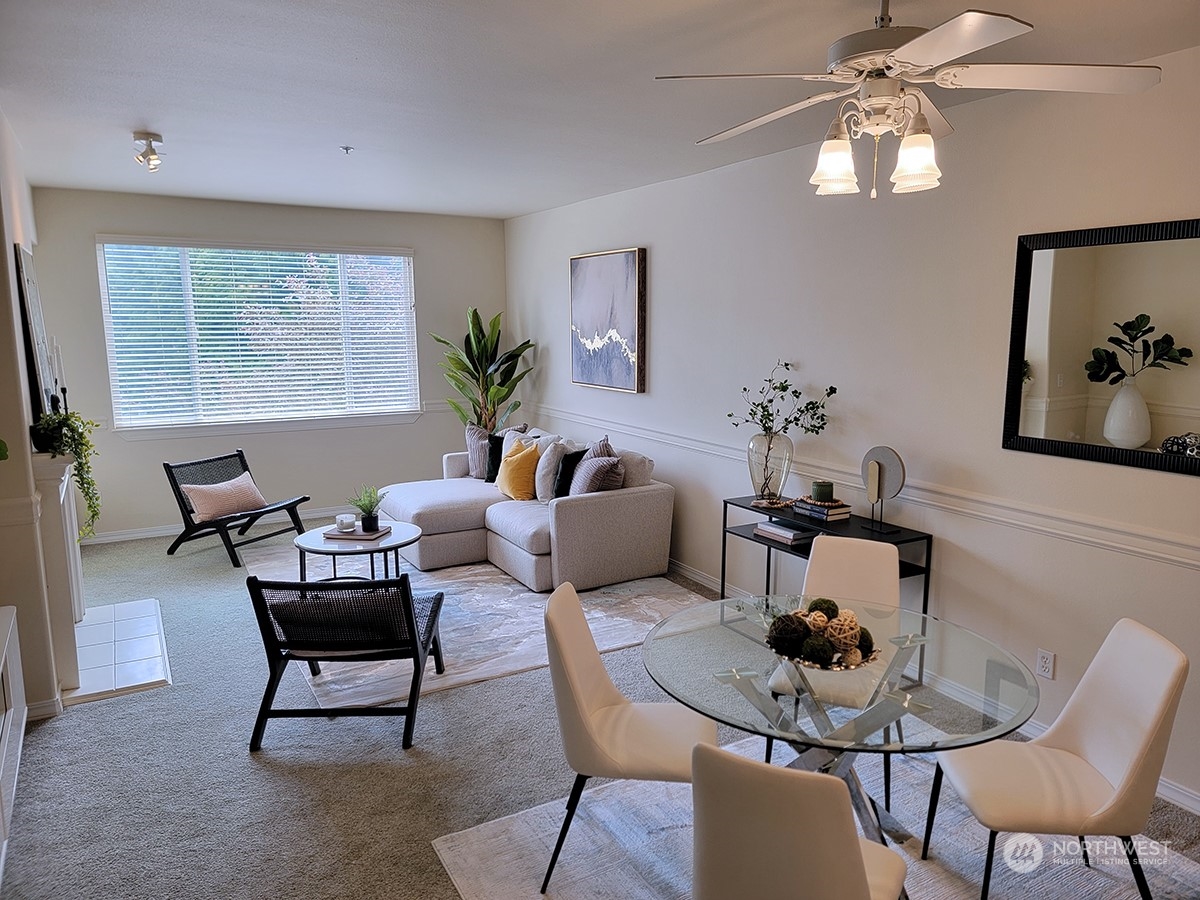 440 Maple Avenue Southwest, Unit A203 Renton, WA 98057 - Photo 16 of 33 a living room with furniture and a large window