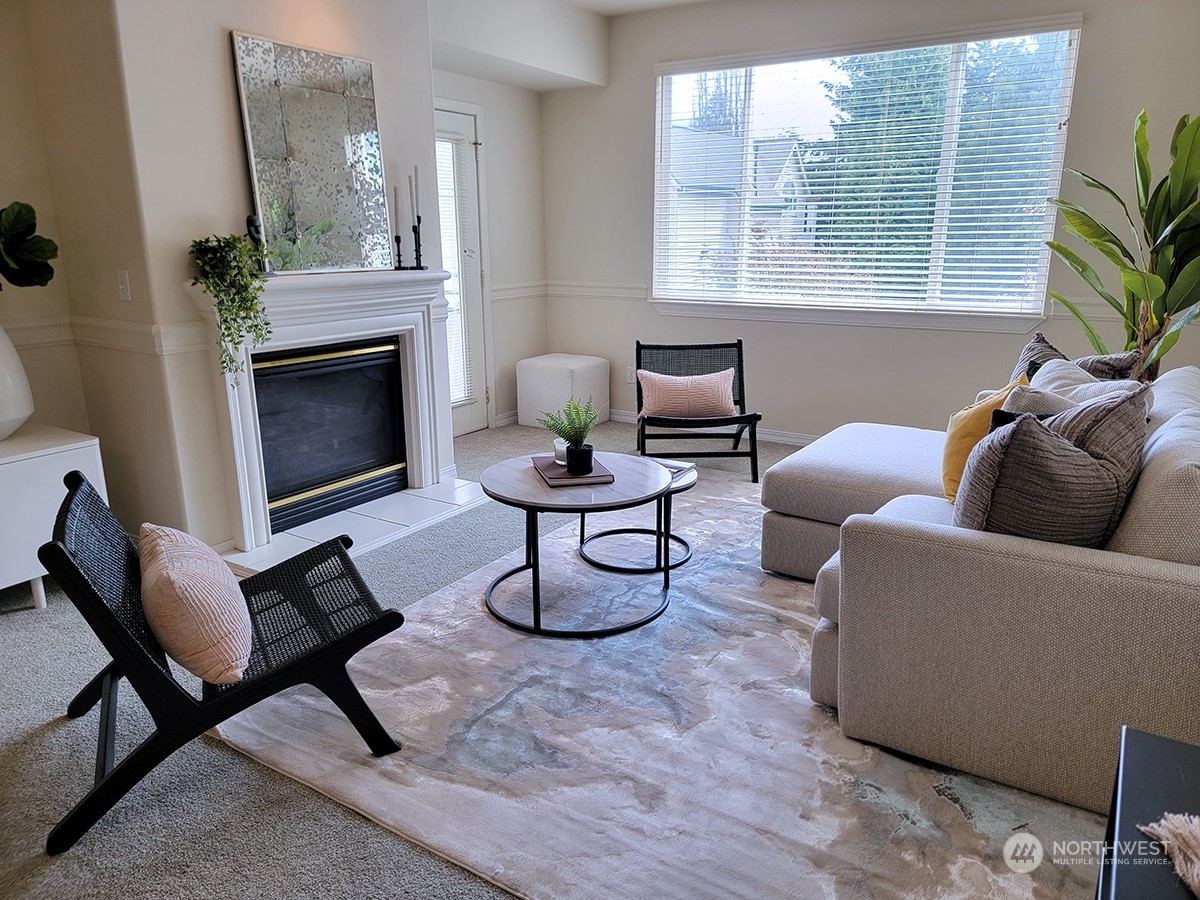 440 Maple Avenue Southwest, Unit A203 Renton, WA 98057 - Photo 21 of 33 a living room with furniture and a fireplace