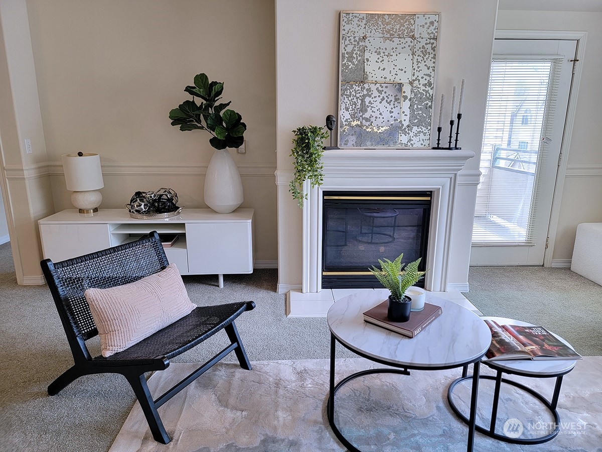 440 Maple Avenue Southwest, Unit A203 Renton, WA 98057 - Photo 22 of 33 a living room with furniture and a fireplace