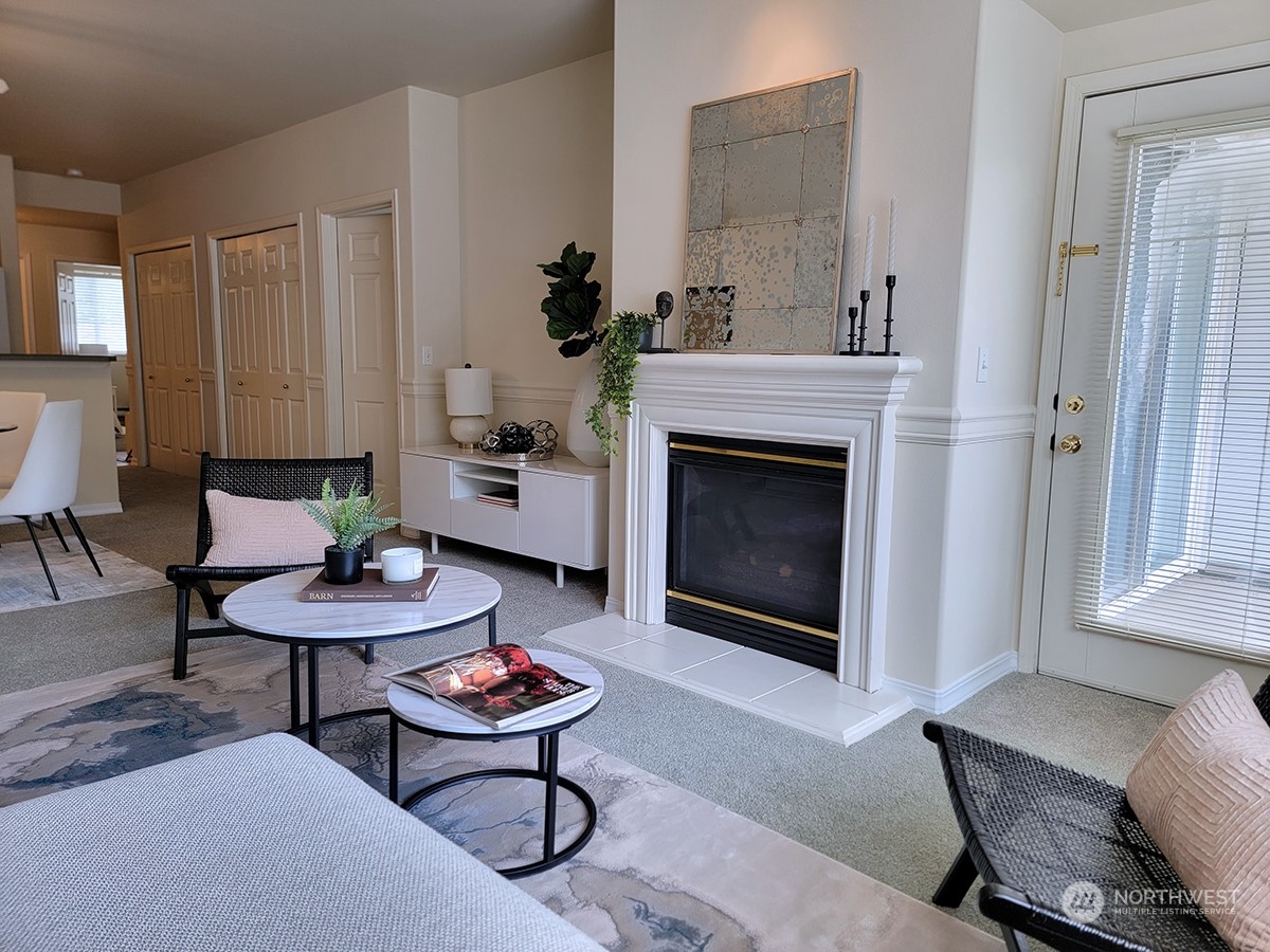 440 Maple Avenue Southwest, Unit A203 Renton, WA 98057 - Photo 24 of 33 a living room with furniture and a fireplace