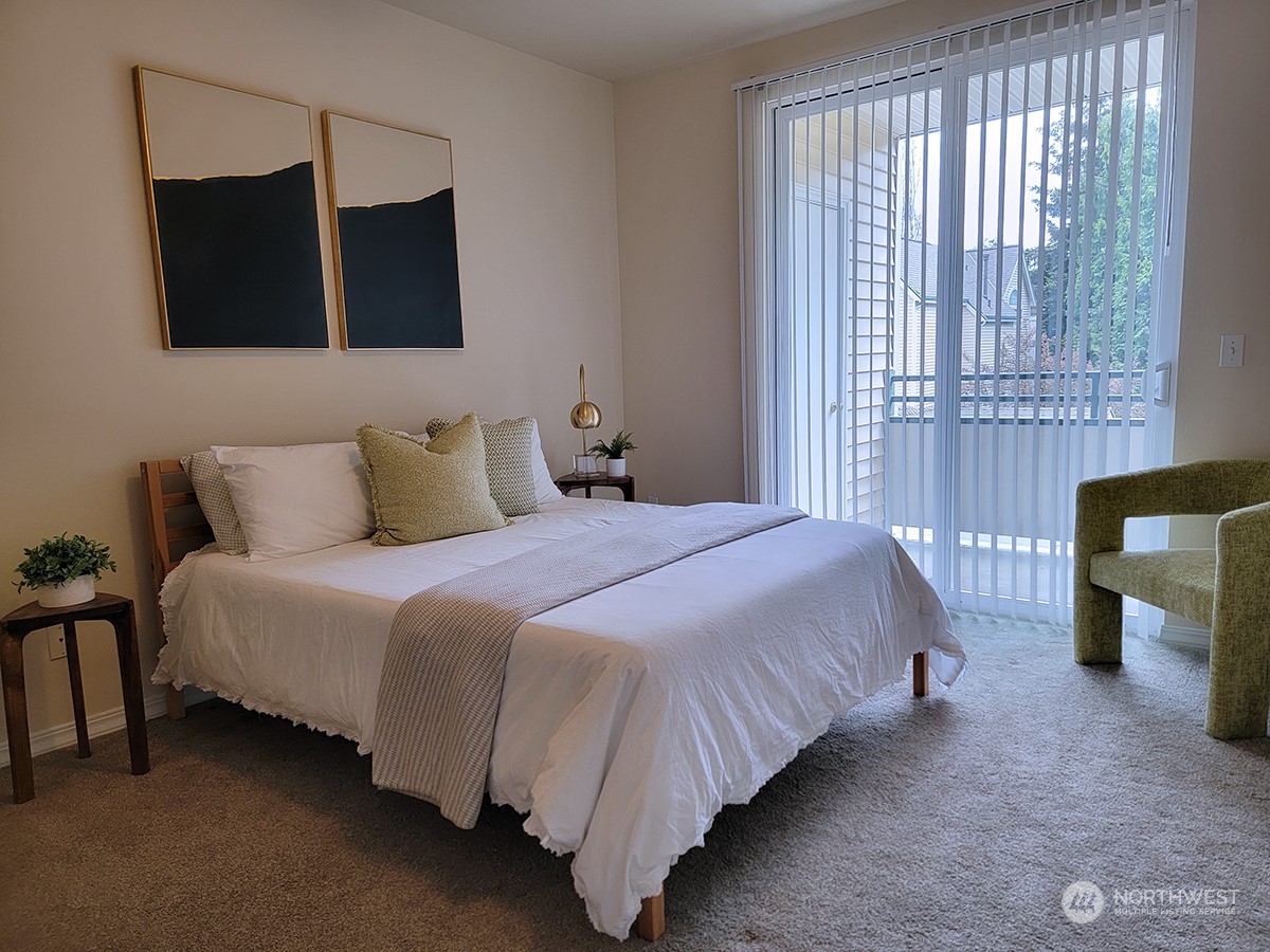 440 Maple Avenue Southwest, Unit A203 Renton, WA 98057 - Photo 26 of 33 a bedroom with a bed and walk in closet