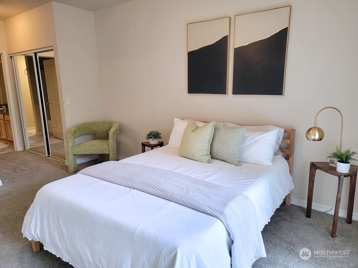 440 Maple Avenue Southwest, Unit A203 Renton, WA 98057 - Photo 27 of 33 a bedroom with a bed and flat screen tv