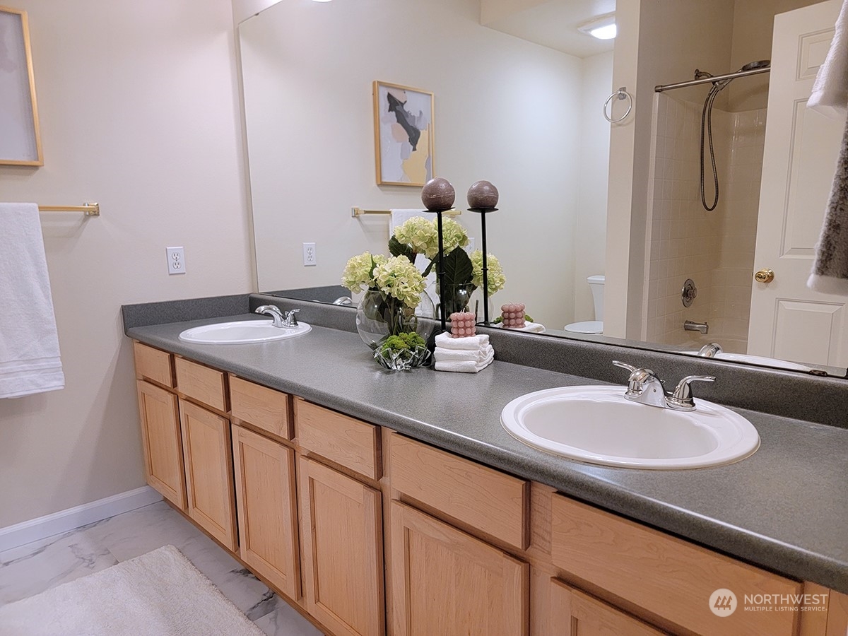 440 Maple Avenue Southwest, Unit A203 Renton, WA 98057 - Photo 28 of 33 a bathroom with a sink and a mirror