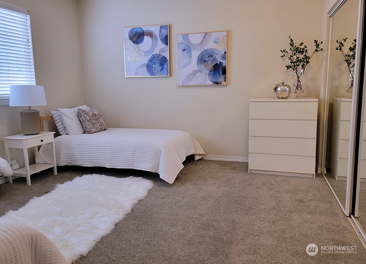 440 Maple Avenue Southwest, Unit A203 Renton, WA 98057 - Photo 9 of 33 a bedroom with a bed and a couch