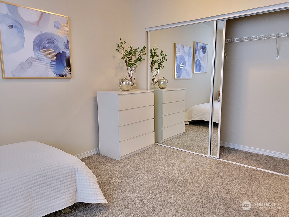 440 Maple Avenue Southwest, Unit A203 Renton, WA 98057 - Photo 10 of 33 a bedroom with a bed and a white comforter