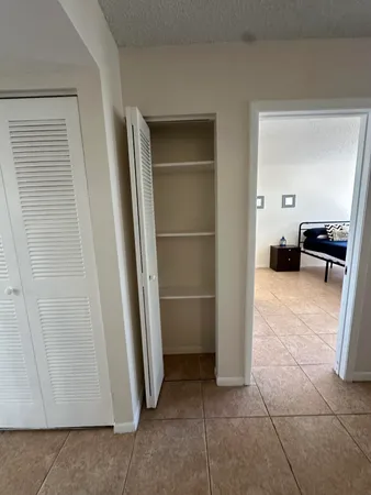 a bathroom with a toilet a sink and a mirror