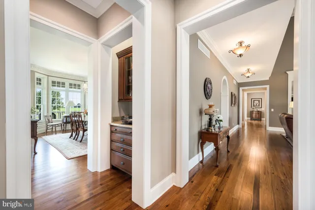 a large kitchen with a large window and kitchen island