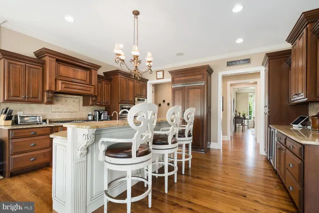 a view of a roof deck with wooden floor and fence next to a yard