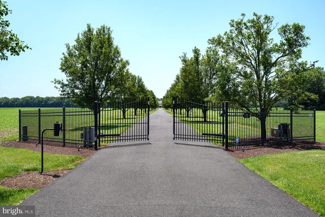 a view of a house with a yard table and chairs