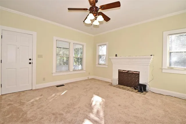 a view of an empty room with a window