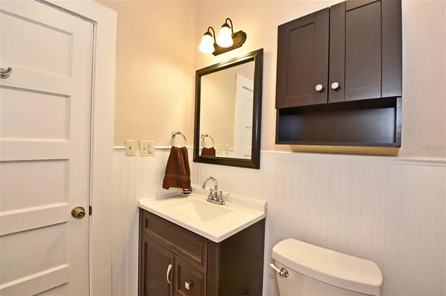 a bathroom with a shower curtain and a sink