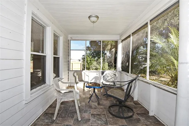 a view of balcony with wooden floor
