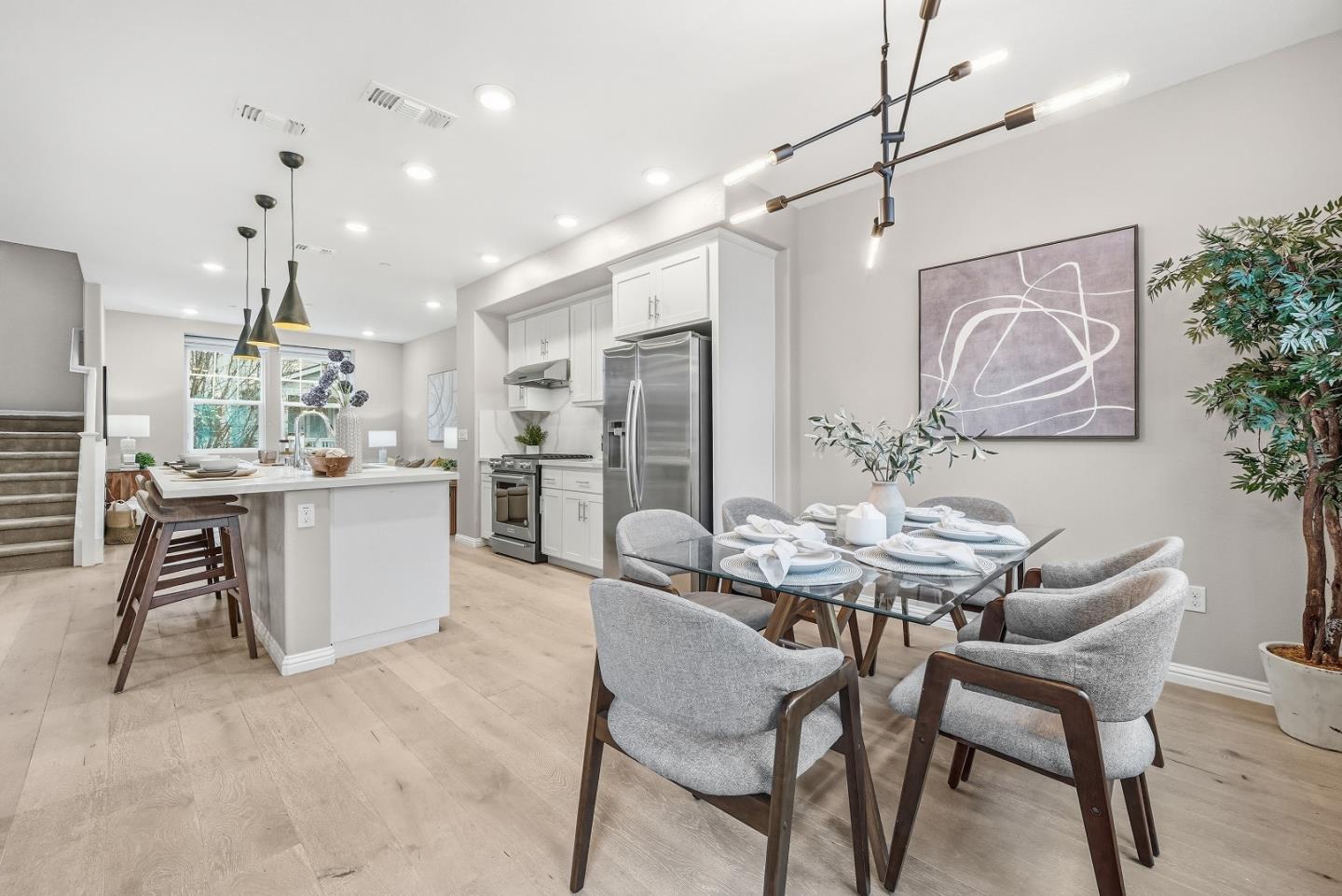 346 Circuit Way Mountain View, CA 94043 - Photo 13 of 65 a kitchen with kitchen island a table and chairs in it