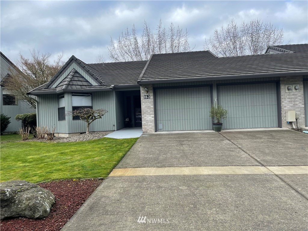 3300 Northeast 164th Street, Unit H2 Ridgefield, WA 98642 - Photo 1 of 24 a house view with a garden space