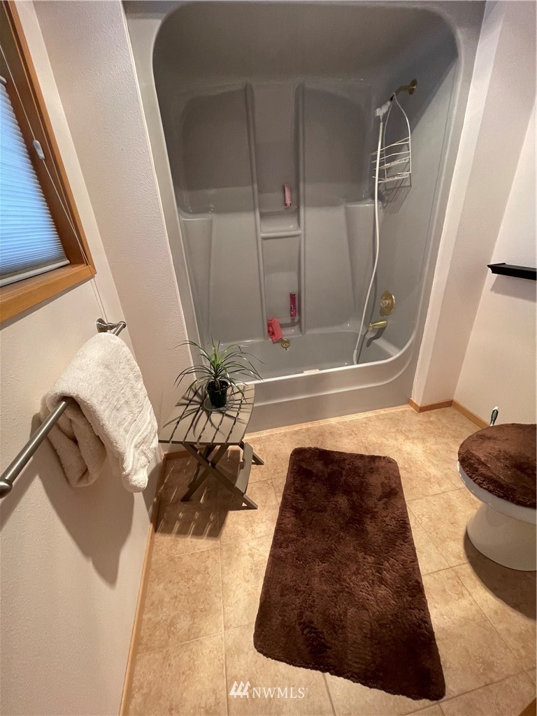 3300 Northeast 164th Street, Unit H2 Ridgefield, WA 98642 - Photo 12 of 24 a bathroom with a bathtub sink and toilet