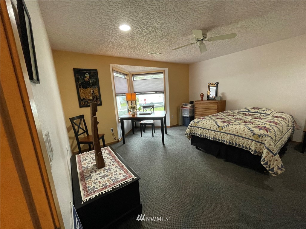 3300 Northeast 164th Street, Unit H2 Ridgefield, WA 98642 - Photo 14 of 24 a bed room with a bed furniture and a window