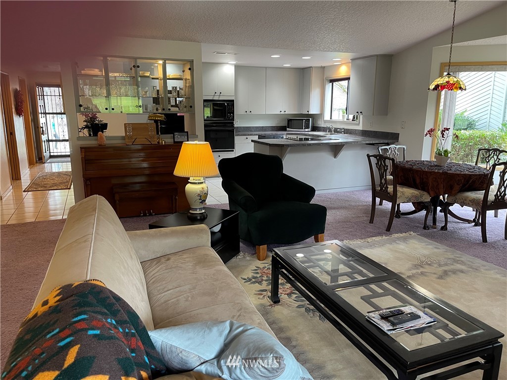 3300 Northeast 164th Street, Unit H2 Ridgefield, WA 98642 - Photo 16 of 24 a living room with furniture and a wooden floor