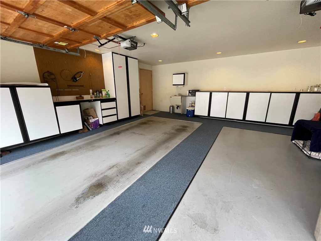 3300 Northeast 164th Street, Unit H2 Ridgefield, WA 98642 - Photo 22 of 24 a view of a garage with wooden floor