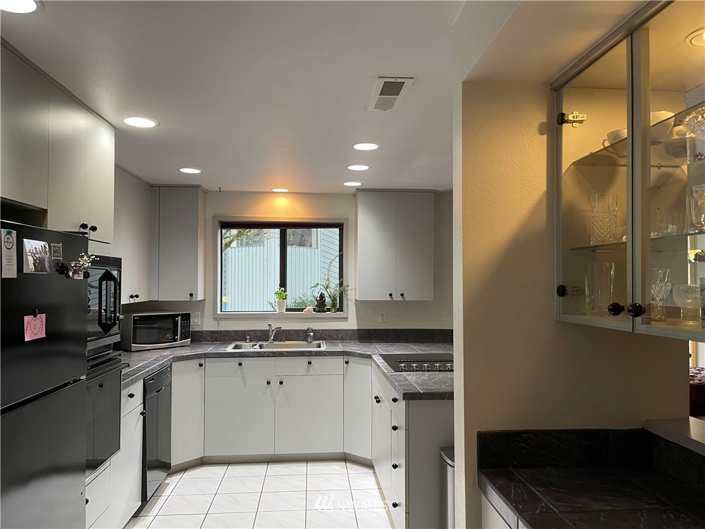 3300 Northeast 164th Street, Unit H2 Ridgefield, WA 98642 - Photo 6 of 24 a kitchen with a sink cabinets and window