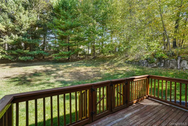 a view of a balcony with wooden floor