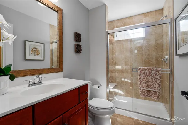 a living room with furniture a clock and a window