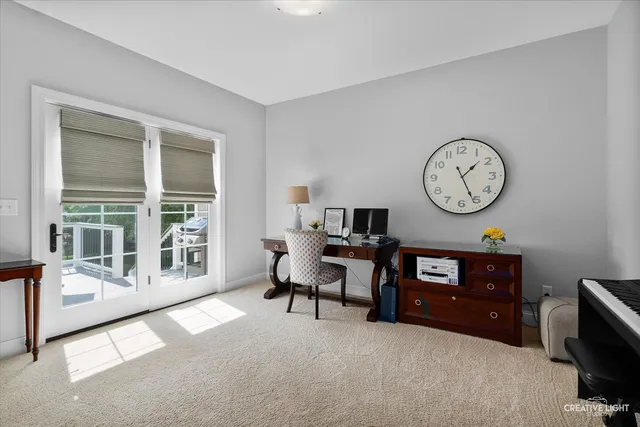 a bedroom with a bed couch and window