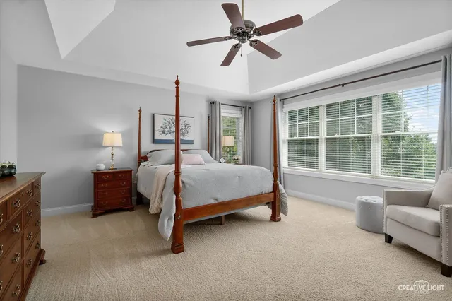 a spacious bedroom with a bed and furniture