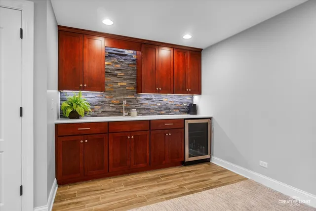 a view of an entryway with wooden floor