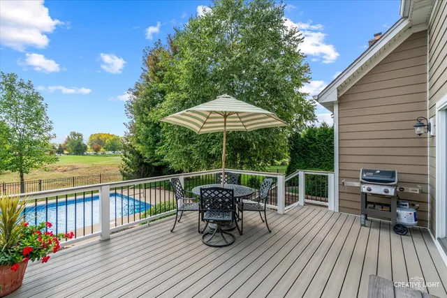 an aerial view of a house with garden space and outdoor seating