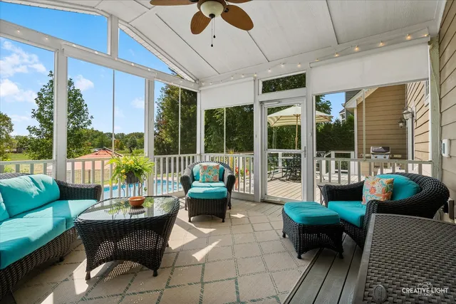 a balcony with furniture and a potted plant