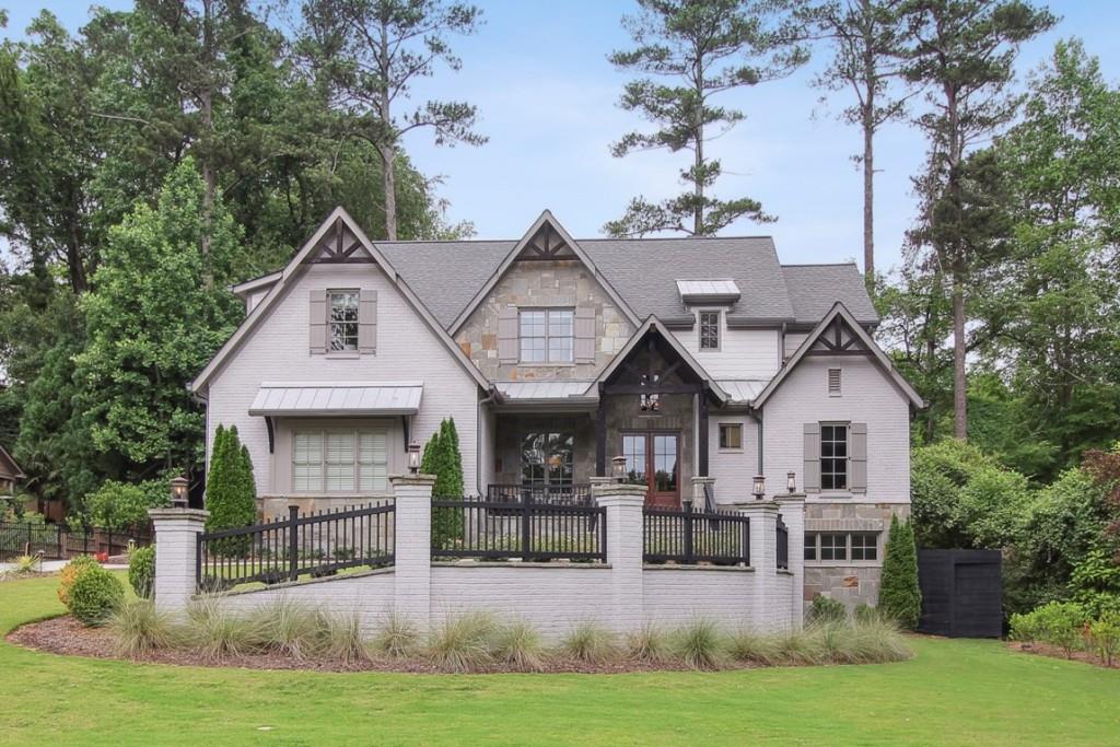 1202 Goodwin Road Northeast Atlanta, GA 30324 - Photo 1 of 1 a front view of a house with a yard