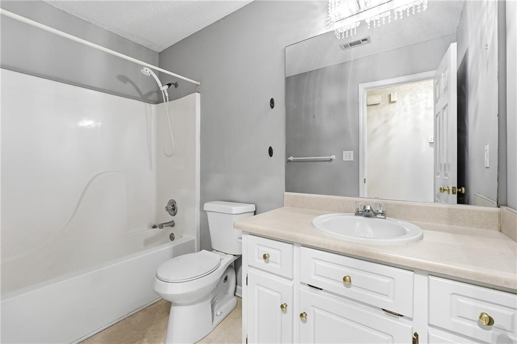 186 Franklin Court Jasper, GA 30143 - Photo 16 of 30 a bathroom with a sink a toilet and shower