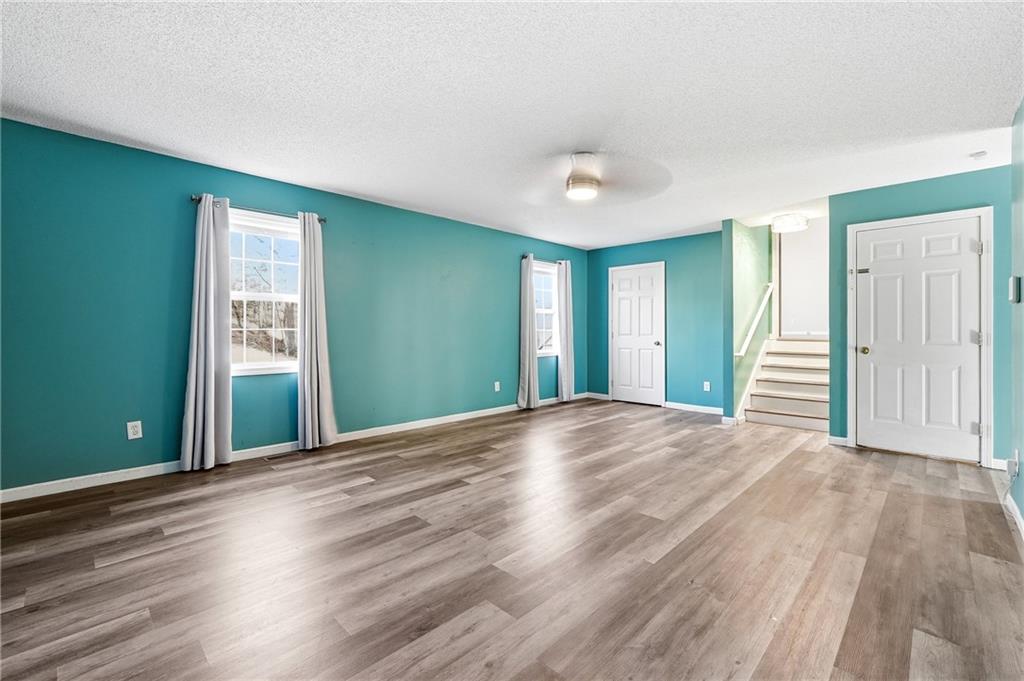 186 Franklin Court Jasper, GA 30143 - Photo 19 of 30 a view of an empty room with wooden floor and a window