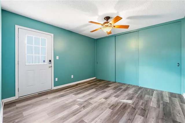 en empty room with a fan and fan