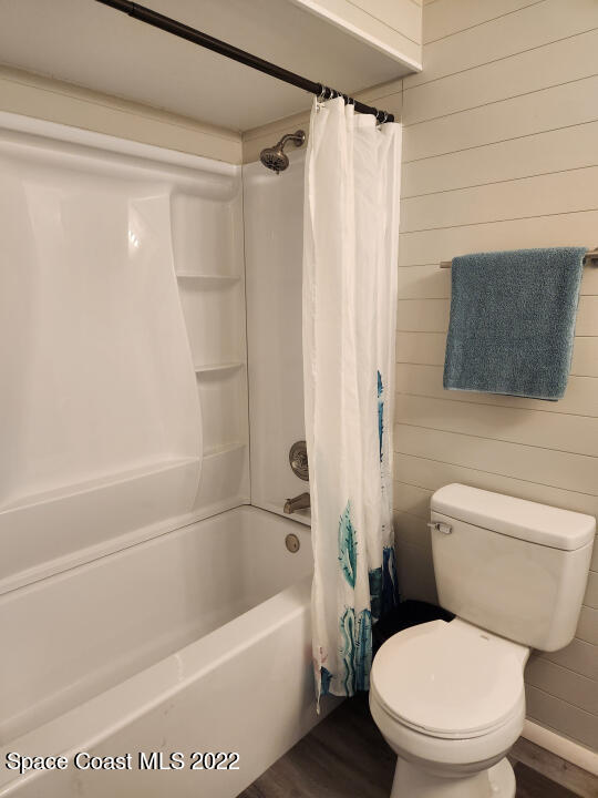 1267 Cotton Road Northeast Palm Bay, FL 32905 - Photo 17 of 30 a white toilet sitting next to a bath tub