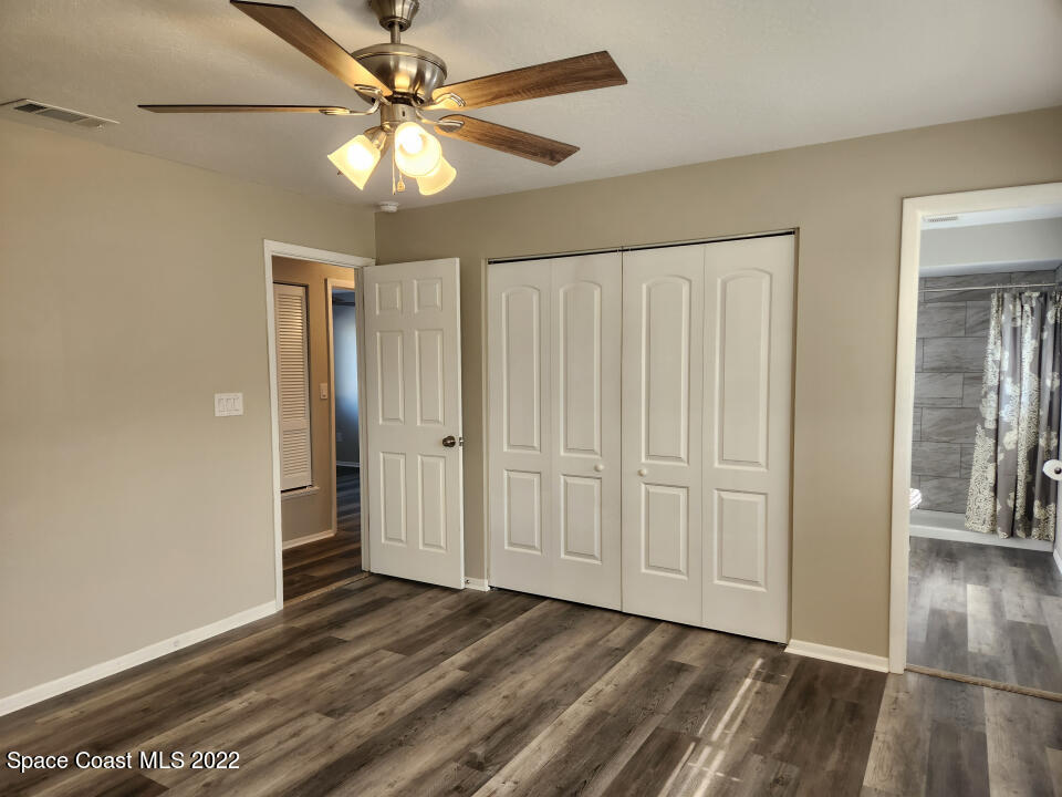 1267 Cotton Road Northeast Palm Bay, FL 32905 - Photo 22 of 30 a view of a livingroom with a hardwood floor