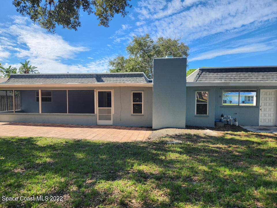 1267 Cotton Road Northeast Palm Bay, FL 32905 - Photo 28 of 30 a house that has a big yard