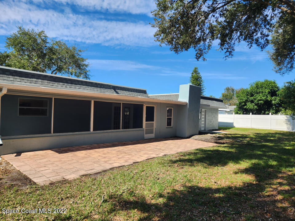 1267 Cotton Road Northeast Palm Bay, FL 32905 - Photo 29 of 30 a front view of a house with a yard