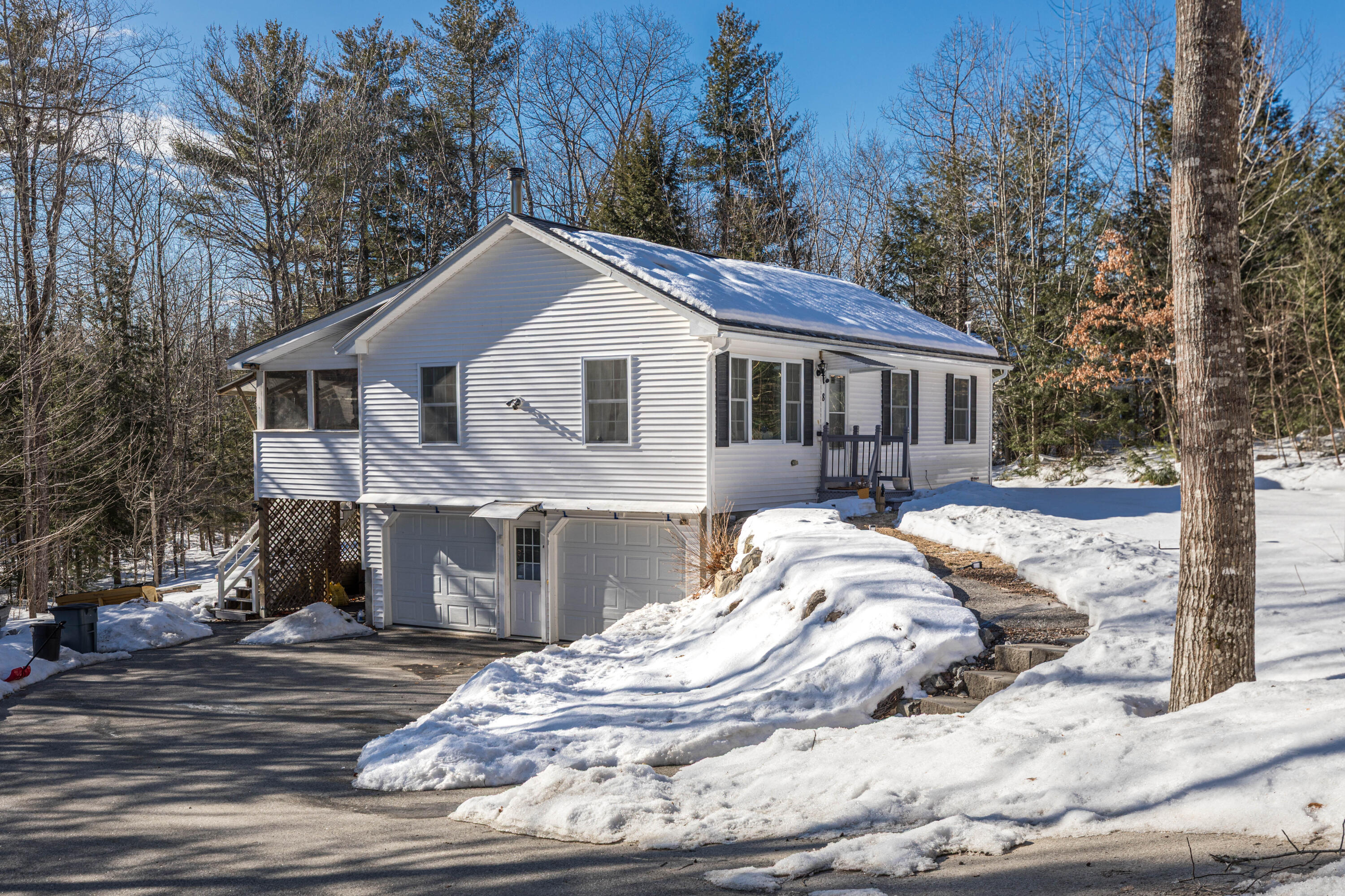 8 Hedgebog Mountain Road Naples, ME 04055 - Photo 4 of 33 side view with garage