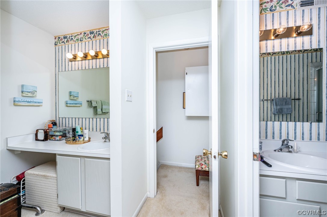 1719 Foxfire Circle Henrico, VA 23238 - Photo 11 of 24 a bathroom with a sink and a mirror