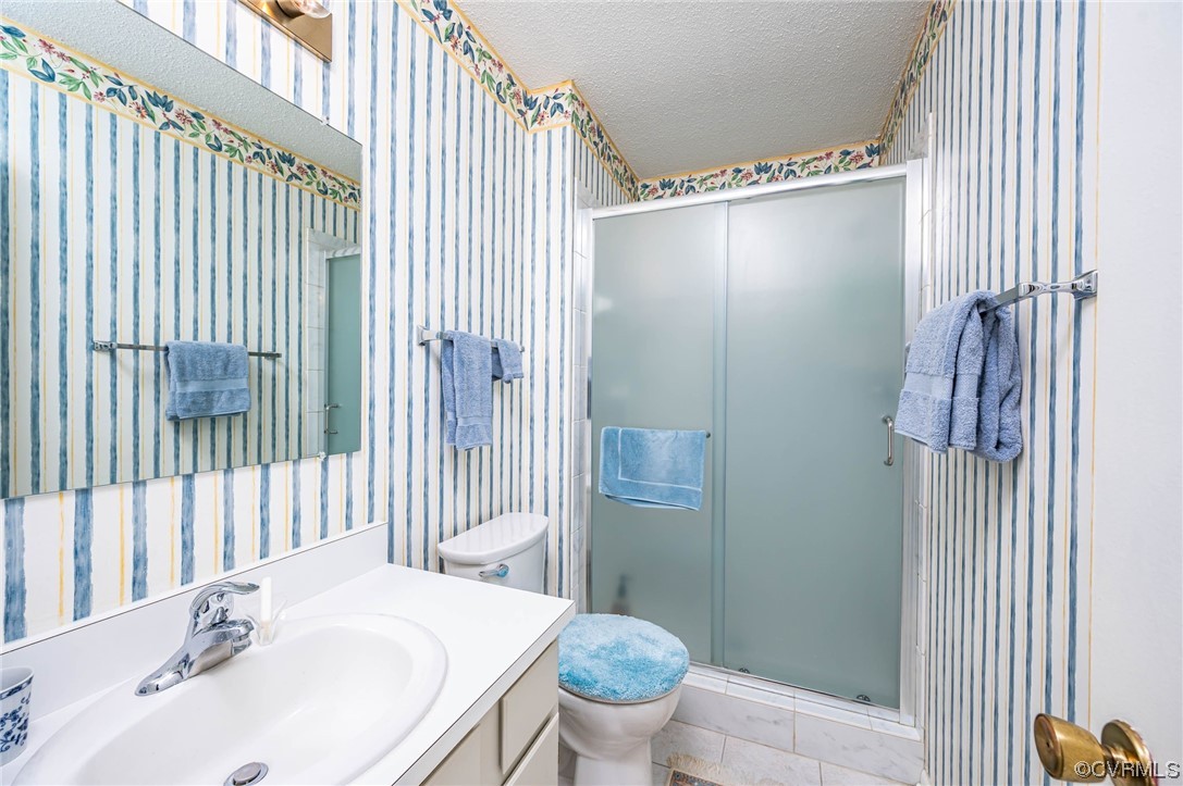 1719 Foxfire Circle Henrico, VA 23238 - Photo 12 of 24 a bathroom with a sink toilet and shower