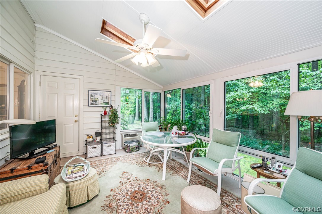 1719 Foxfire Circle Henrico, VA 23238 - Photo 16 of 24 a living room with furniture a flat screen tv and floor to ceiling windows