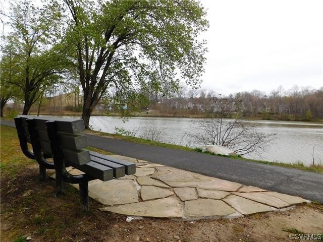 1719 Foxfire Circle Henrico, VA 23238 - Photo 24 of 24 a view of a lake with outdoor seating and trees