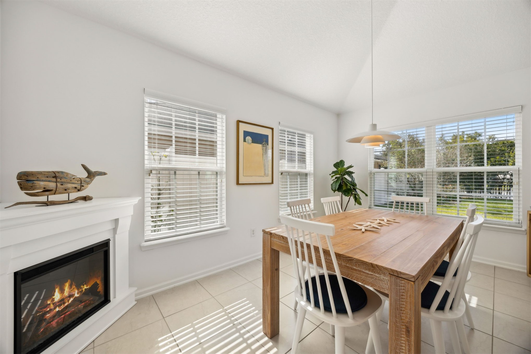 94037 Last Lane Yulee, FL 32097 - Photo 15 of 38 a view of a dining room with furniture window and outside view