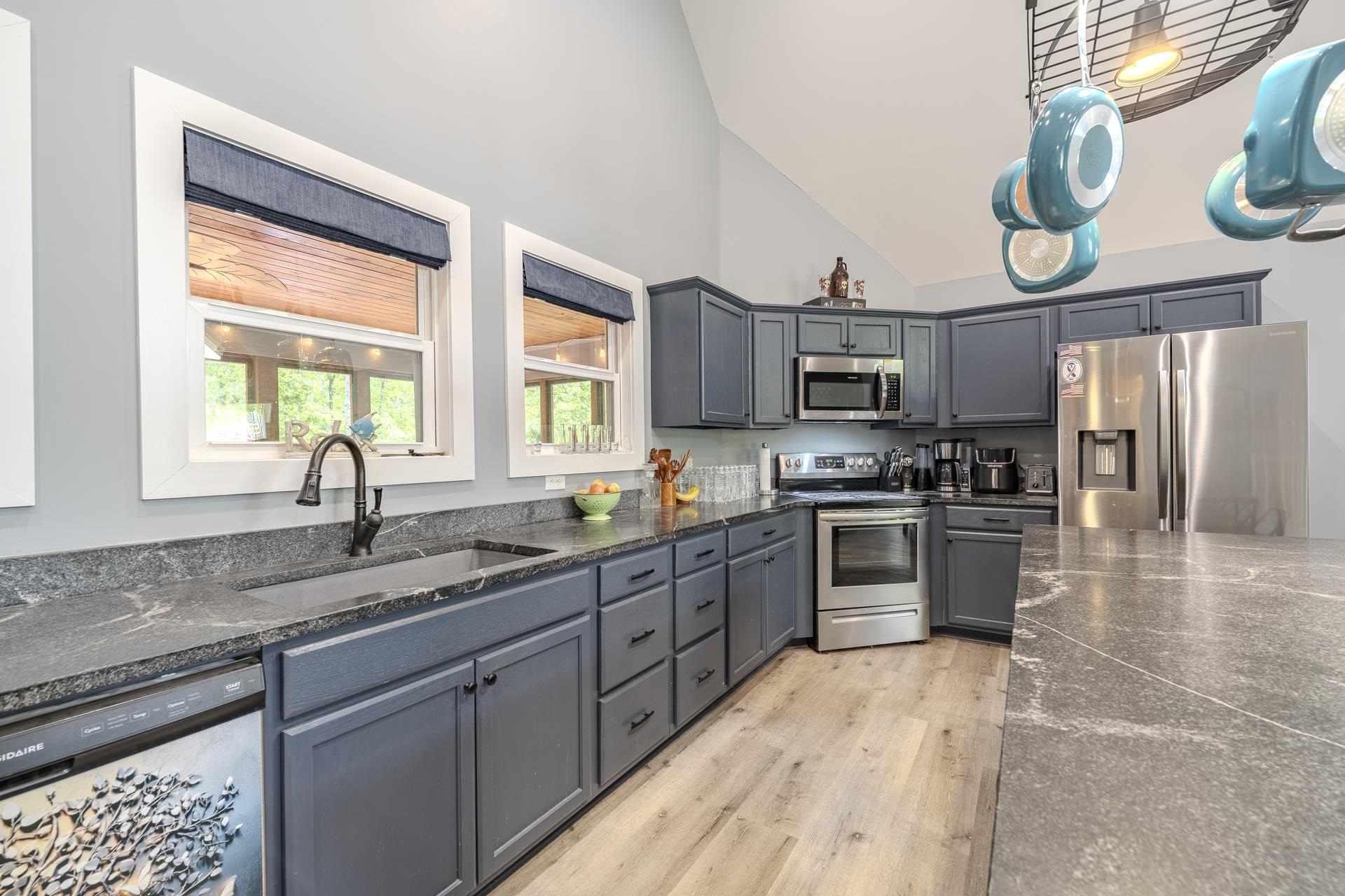 315 Timber Ridge Drive Counce, TN 38326 - Photo 11 of 40 a kitchen with stainless steel appliances granite countertop a sink and cabinets