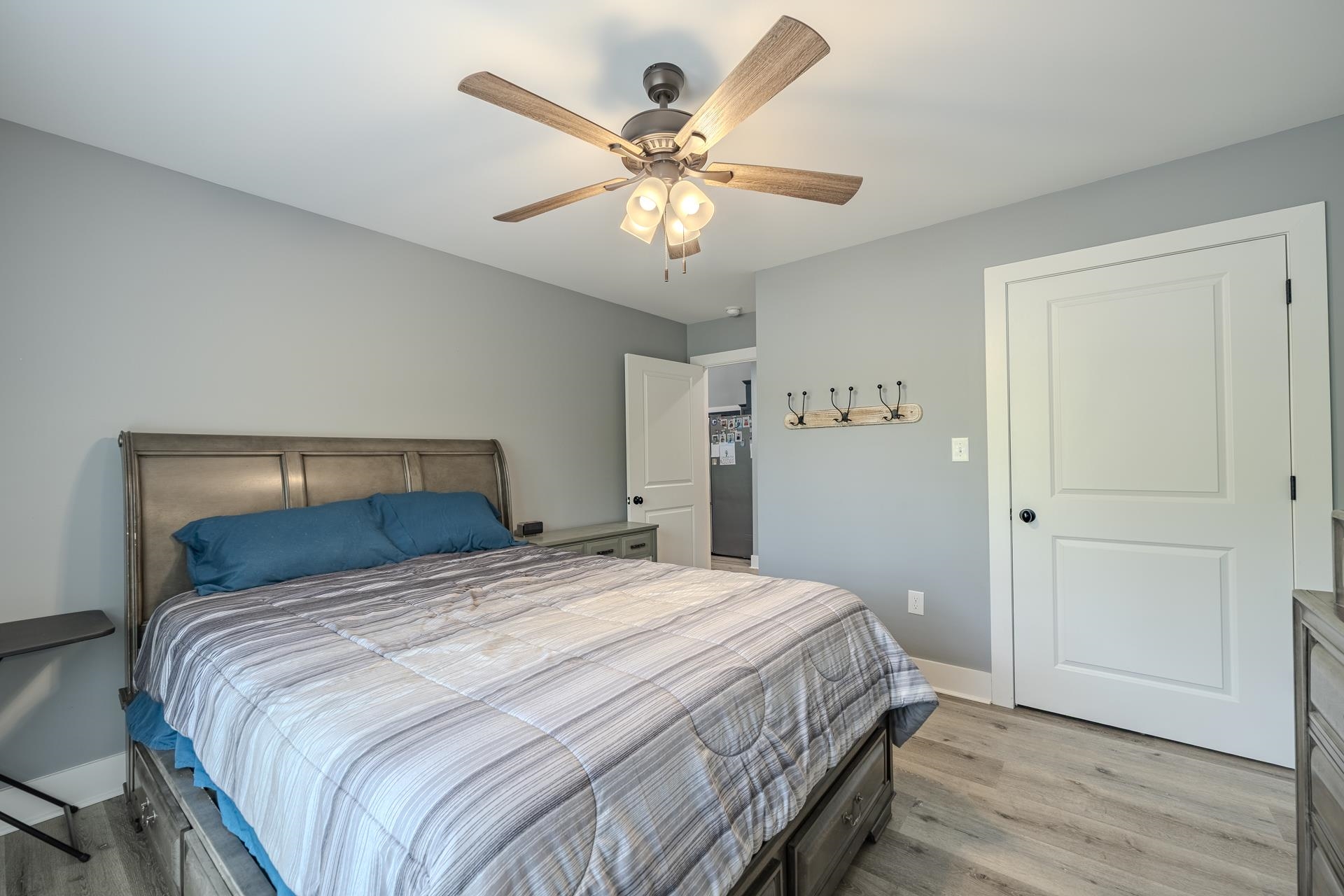 315 Timber Ridge Drive Counce, TN 38326 - Photo 16 of 40 a bedroom with a bed and a chandelier